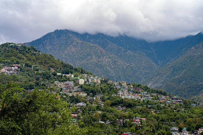 a view of a city nestled in the mountains